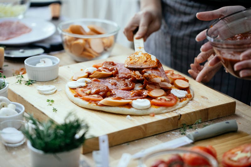 Community pizza making class event at Dewey's pizza
